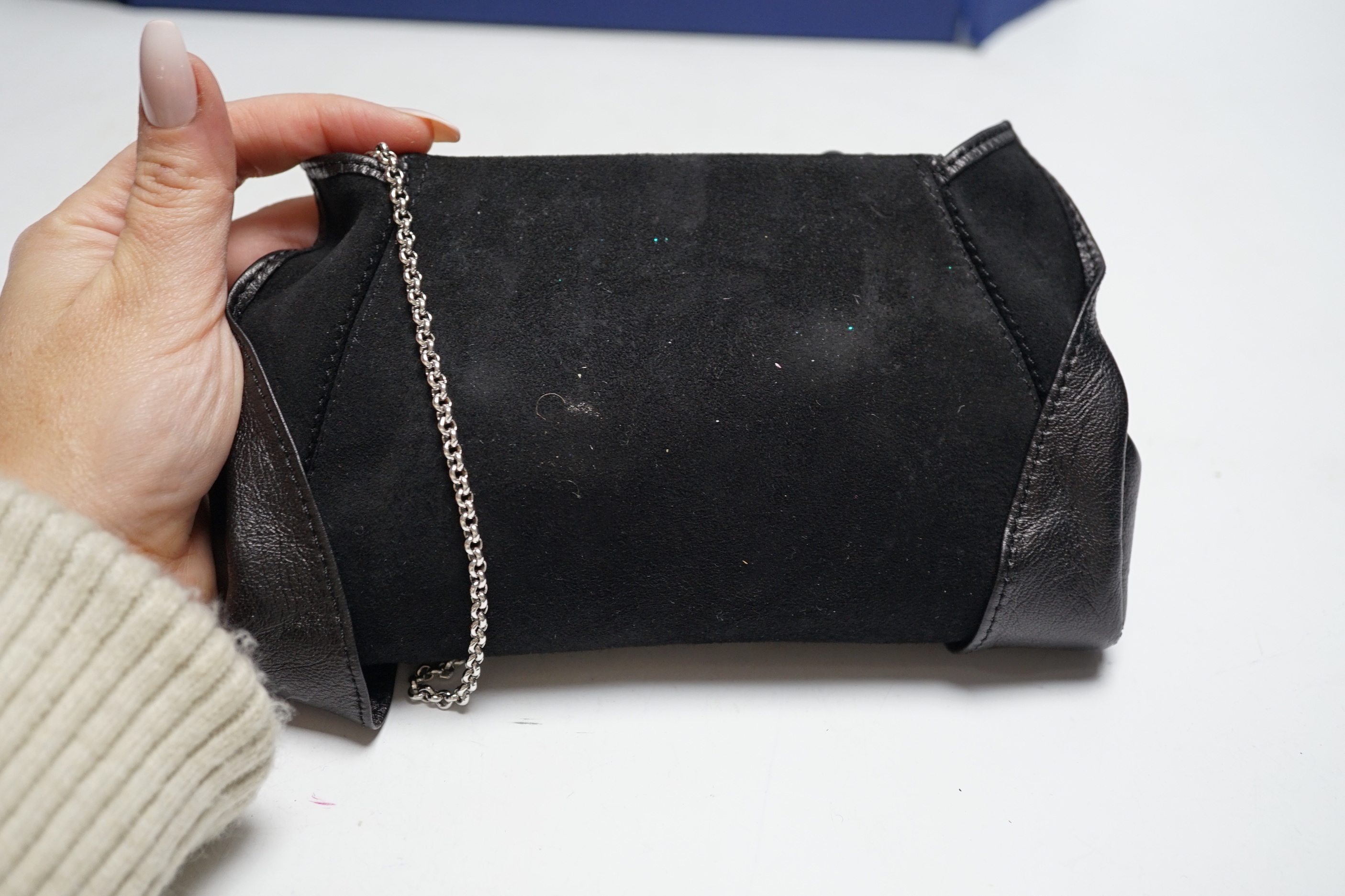 A Swarovski diamanté decorated black suede and leather evening bag, with chain handle, dust bag, box and cover